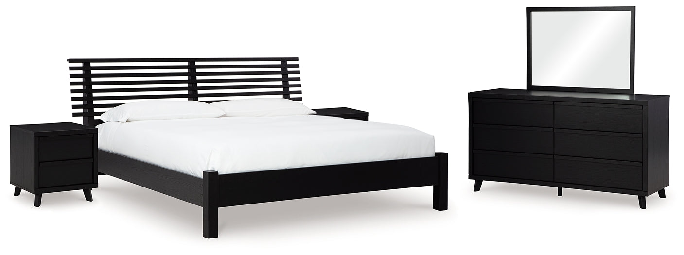 Danziar King Panel Bed with Mirrored Dresser and 2 Nightstands